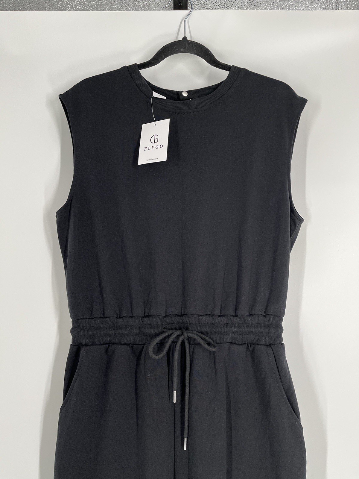 NWT Flygo jumpsuit size L black sleeveless tapered leg waist drawstring stretch