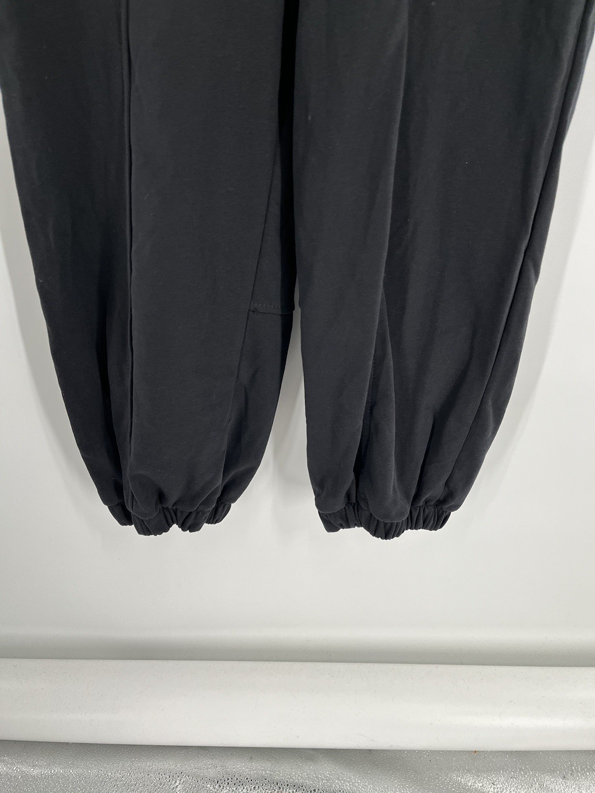 NWT Flygo jumpsuit size L black sleeveless tapered leg waist drawstring stretch