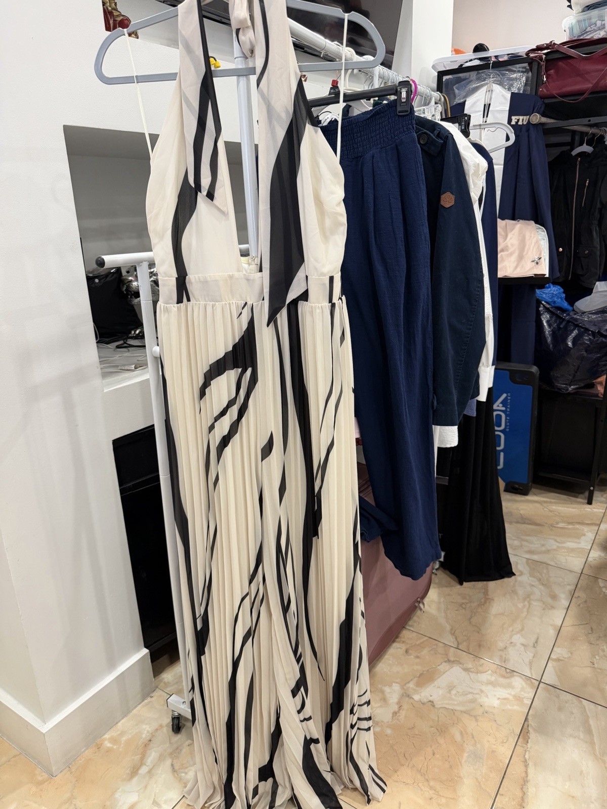 This Fashion Nova Tropicana Jumpsuit Features A Black and White Size Large New