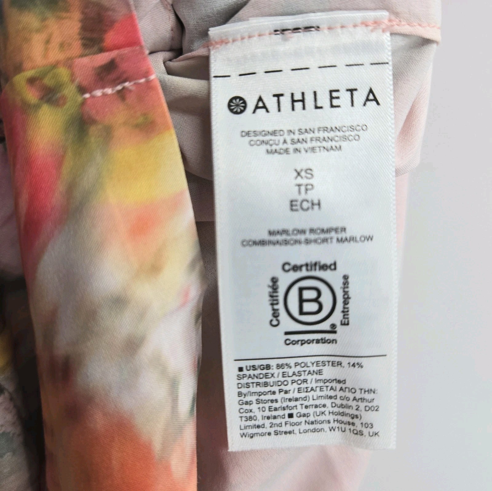 Athleta Marlow Romper Size XS Tall Peach Floral Pockets Activewear Athlesure
