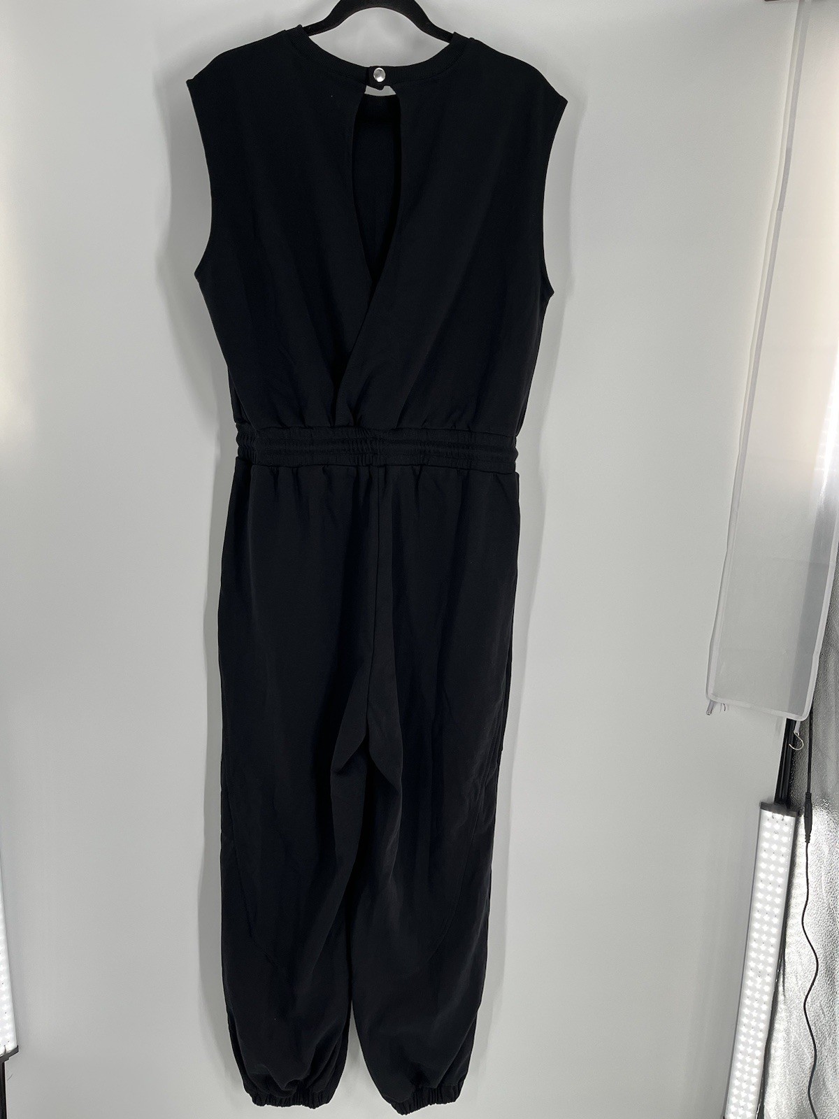 NWT Flygo jumpsuit size L black sleeveless tapered leg waist drawstring stretch