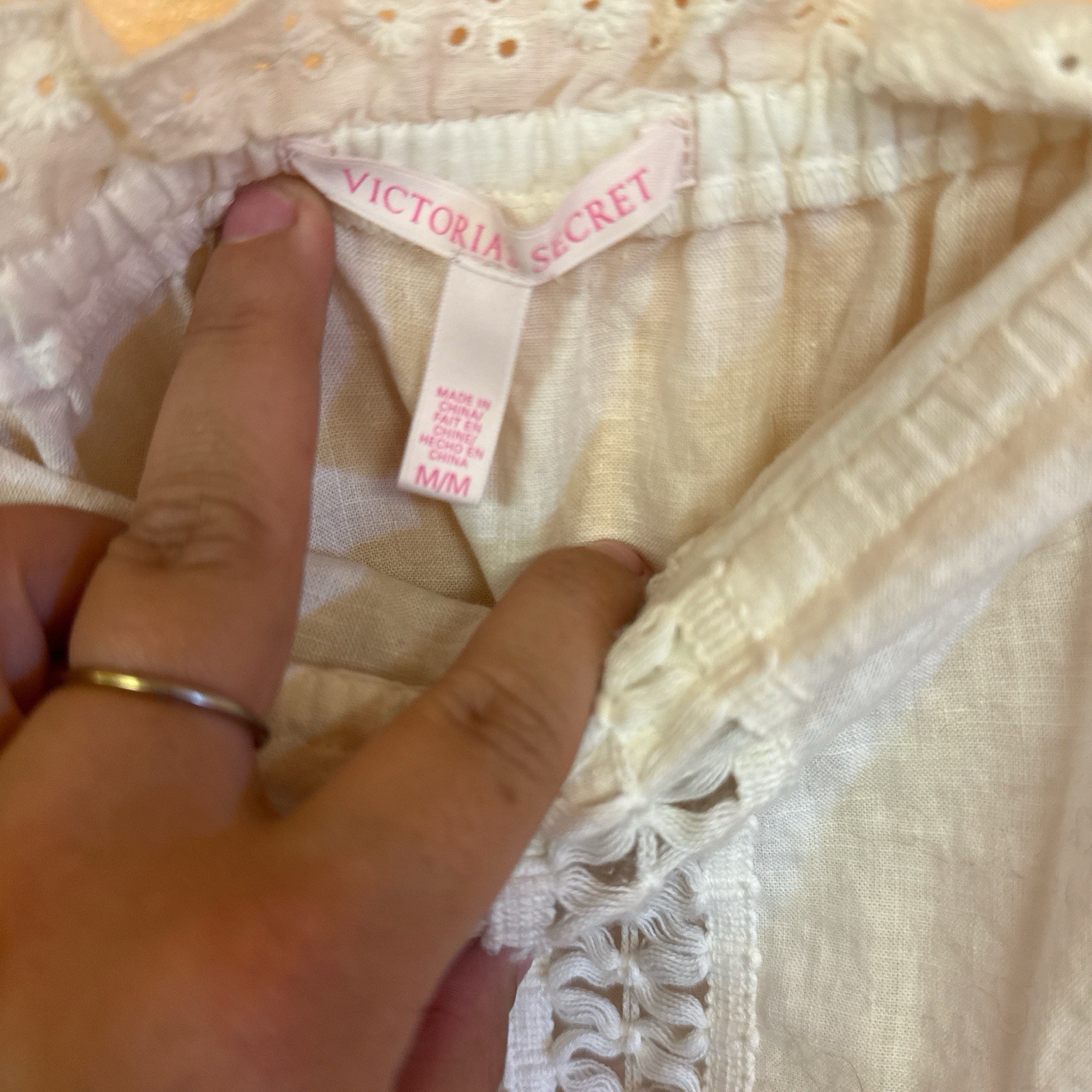 Cream and white romper with lace and tie back detail