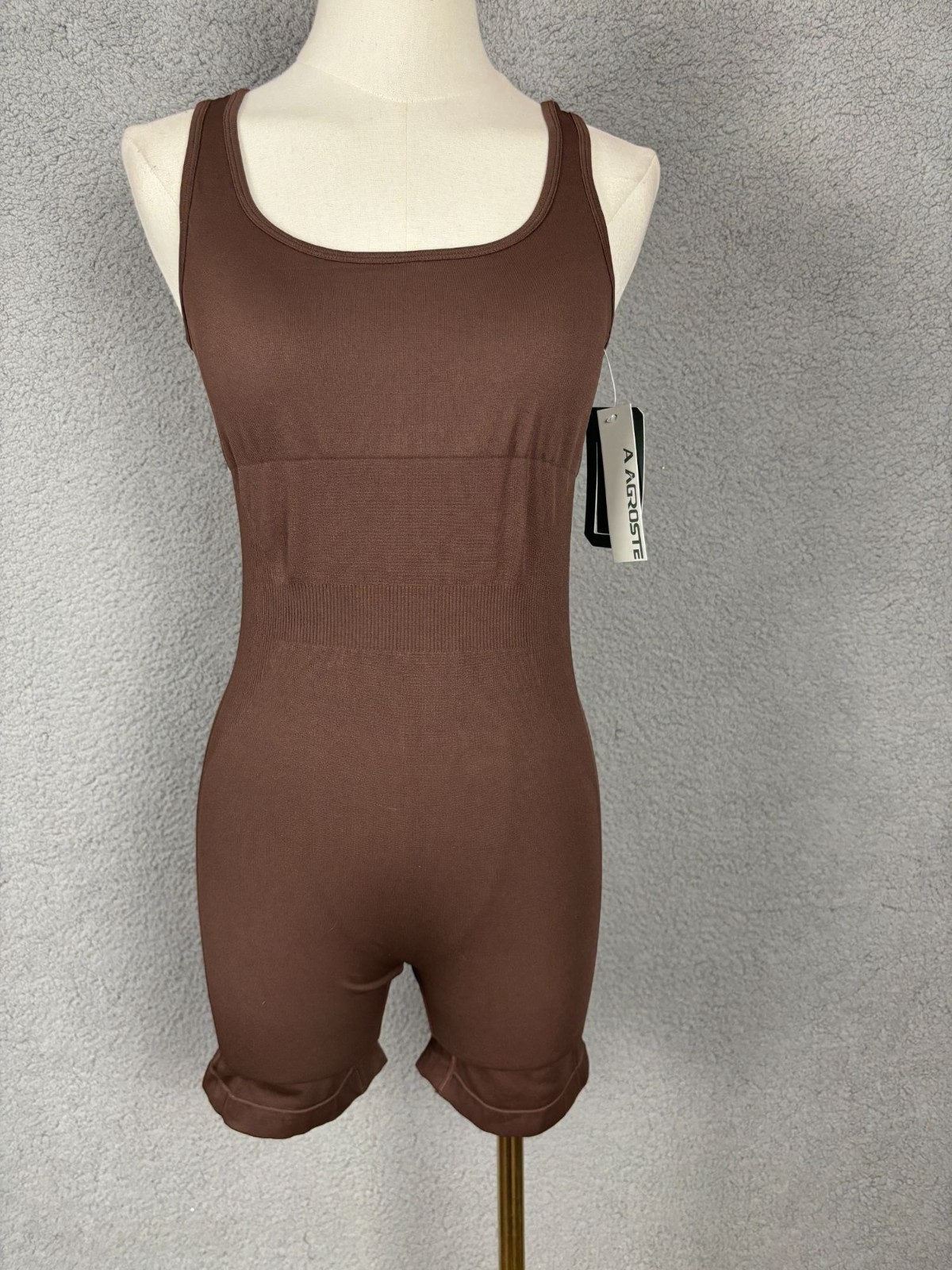 A AGROSTE athletic romper with a racerback Removable Pads Brown Size Small NWT’s