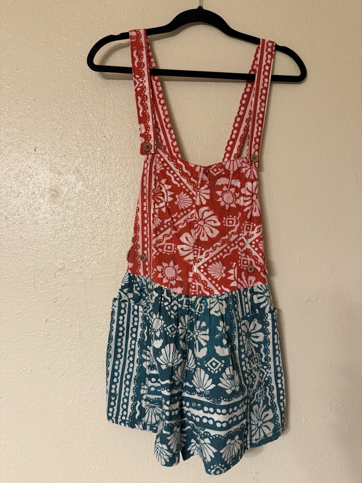 Free People Palm Bay Printed Shortall Romper in a red and green combo.