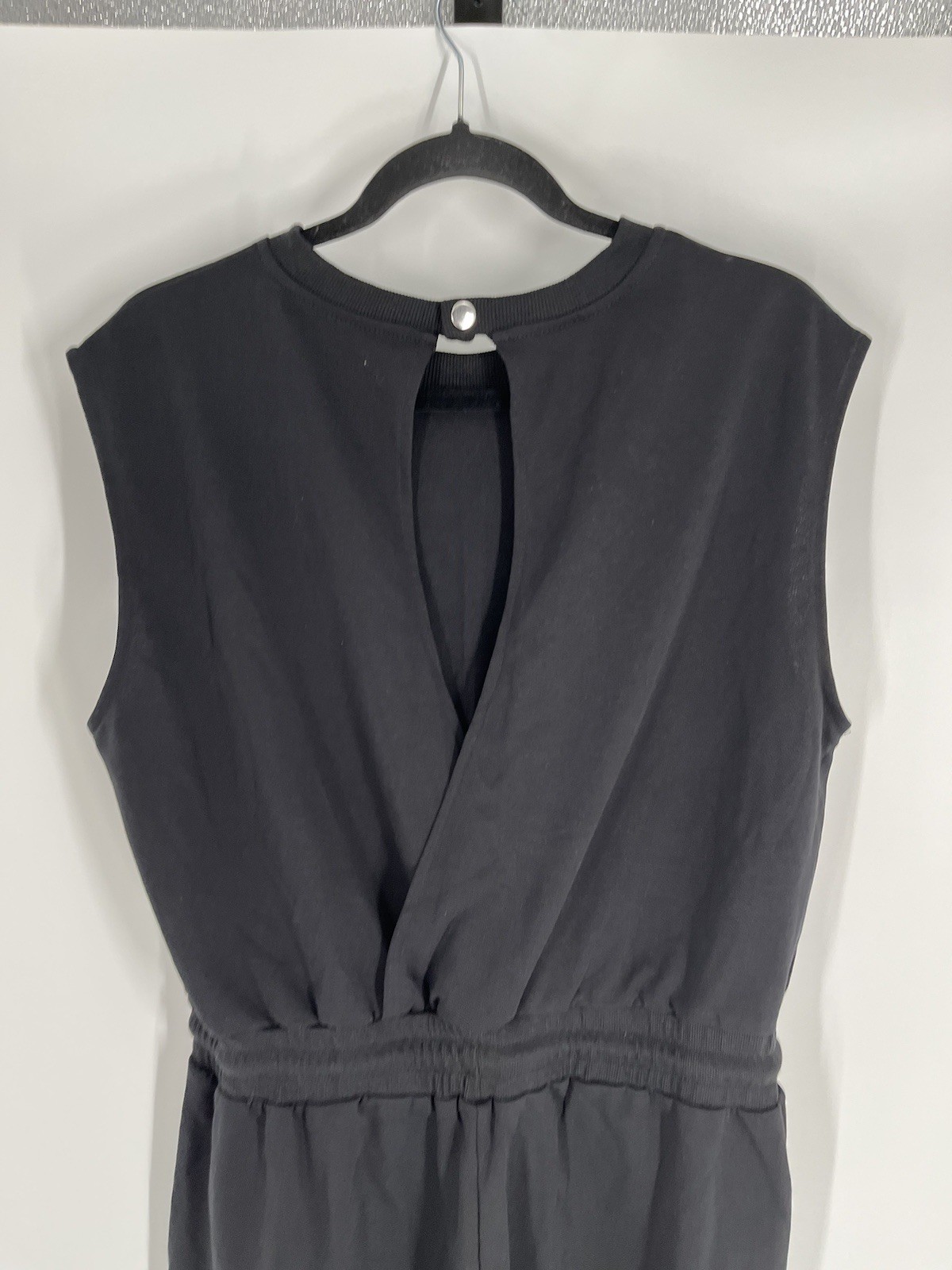 NWT Flygo jumpsuit size L black sleeveless tapered leg waist drawstring stretch