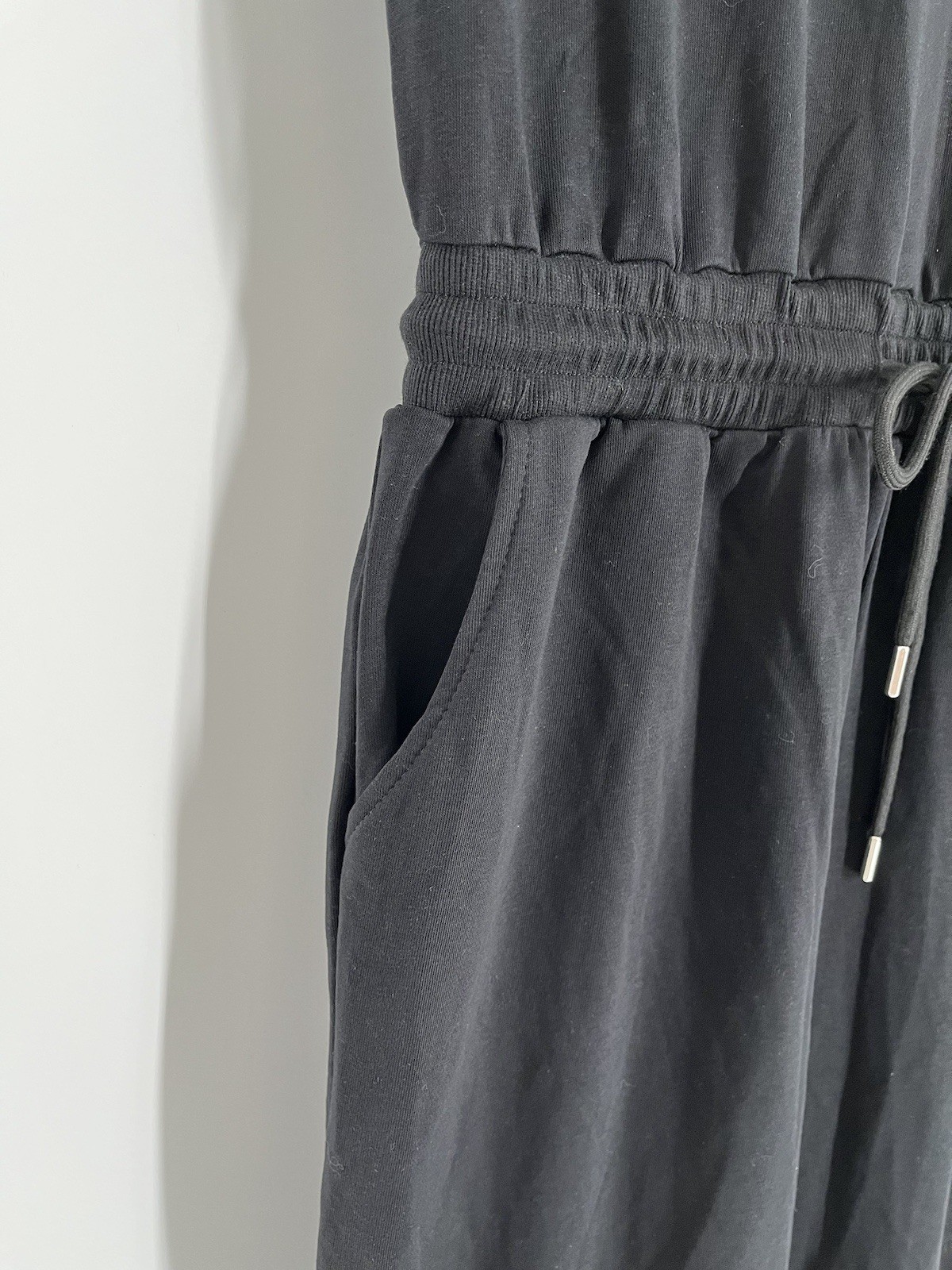 NWT Flygo jumpsuit size L black sleeveless tapered leg waist drawstring stretch