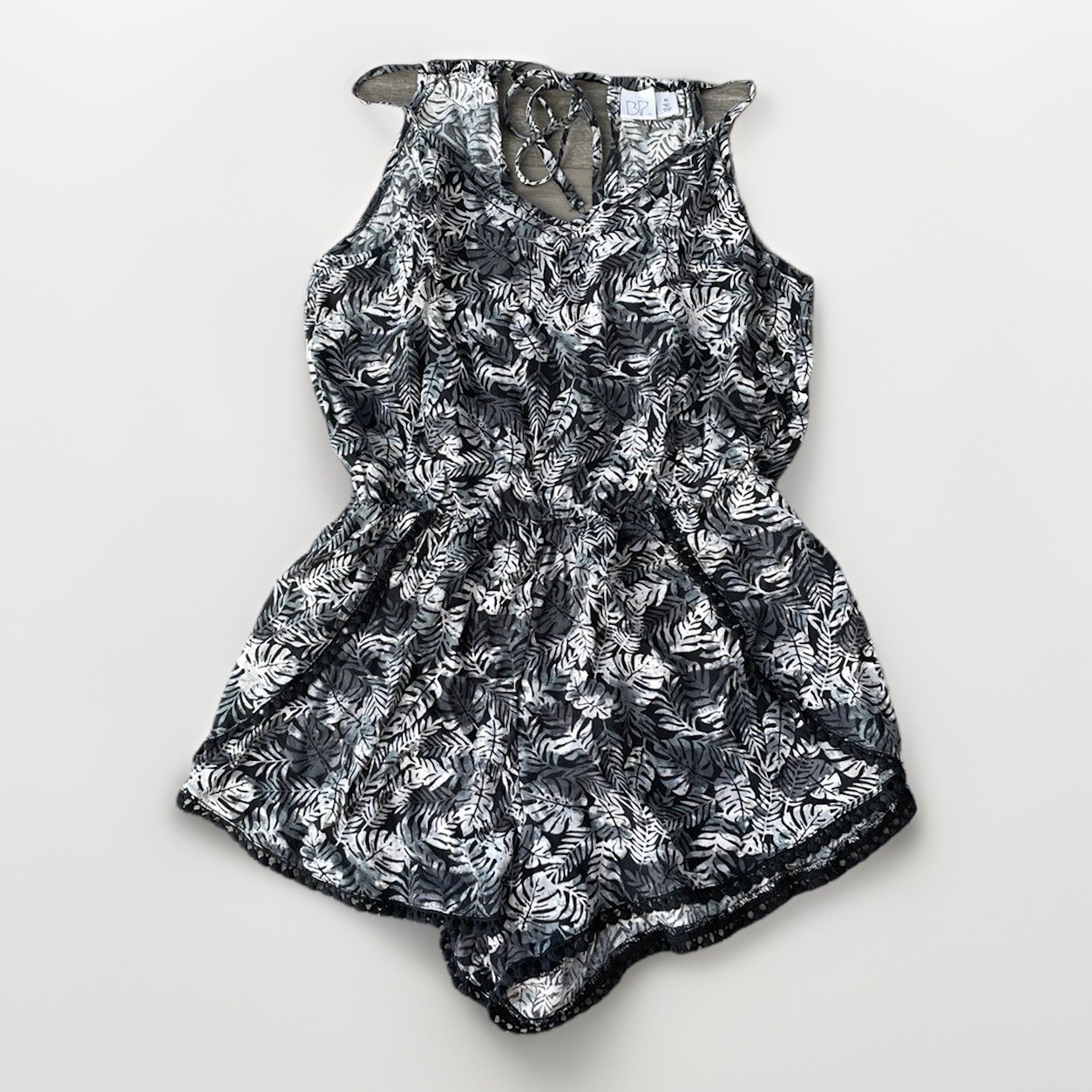 BP Black Floral Romper Size XS Pom Hem Sleeveless Tie